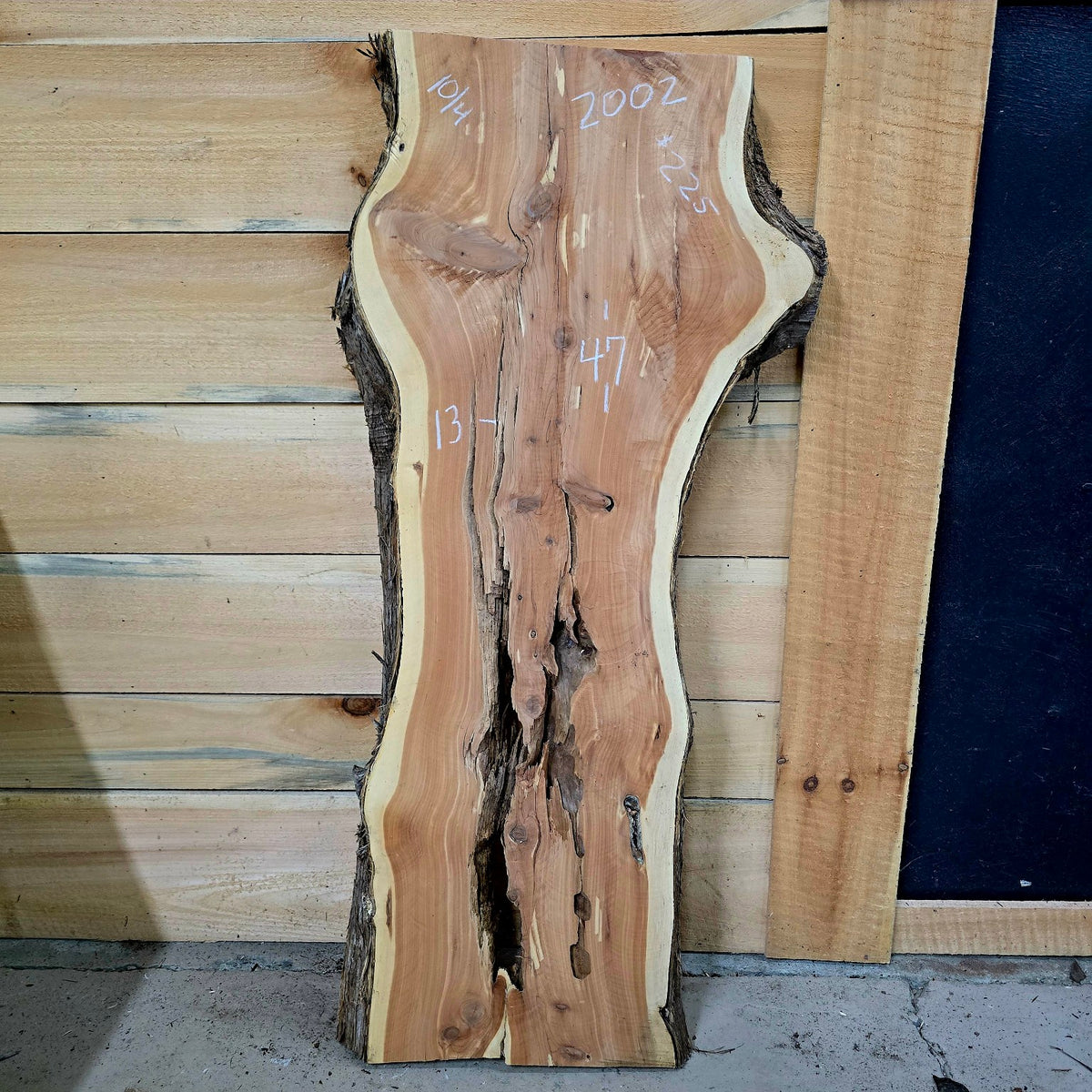 2002 Cedar live edge slab, 47 inches long by 13 inches wide by 10/4 inches thick
